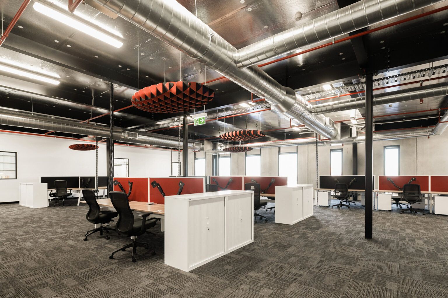 Office cleaning Malaga - industrial open plan office with exposed ductwork serviced by Nexus Kleen
